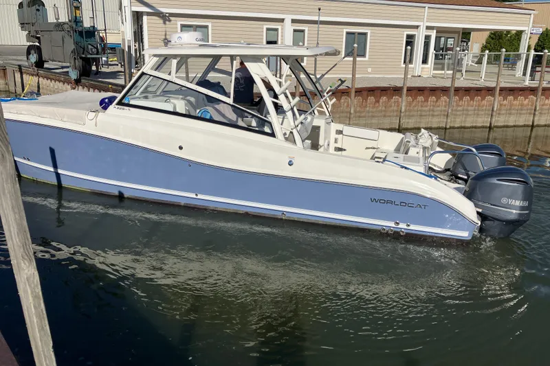 Slide: The Image of 2021 World Cat 320 DC boat with Yamaha engines docked in marina. - 40