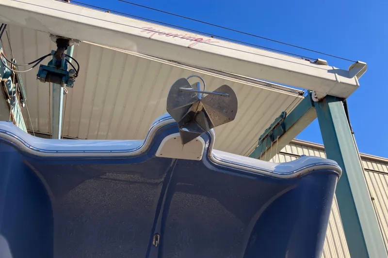 Slide: The Image of 2021 World Cat 320 DC boat under a hoist, viewed from below. - 33