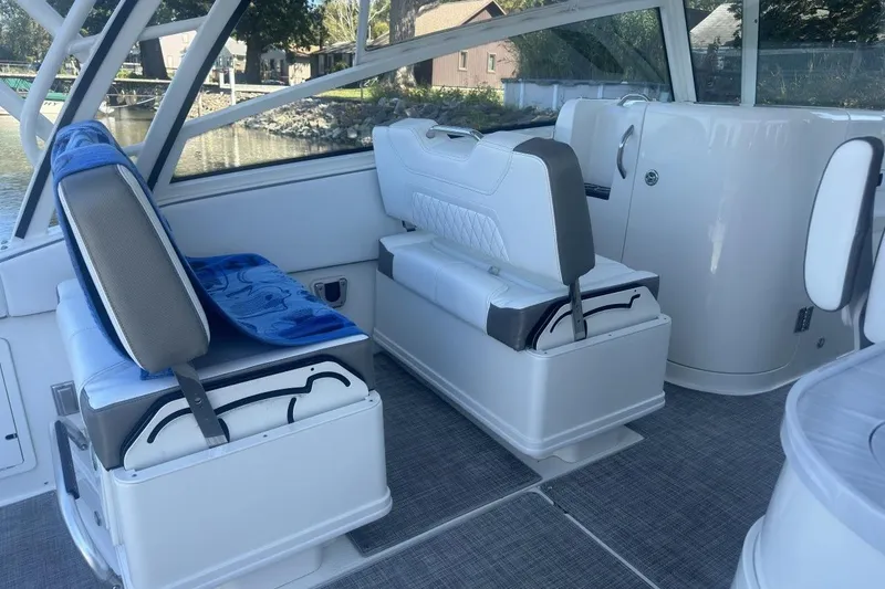 Slide: The Image of 2021 World Cat 320 DC interior with cushioned seating and modern design. - 21