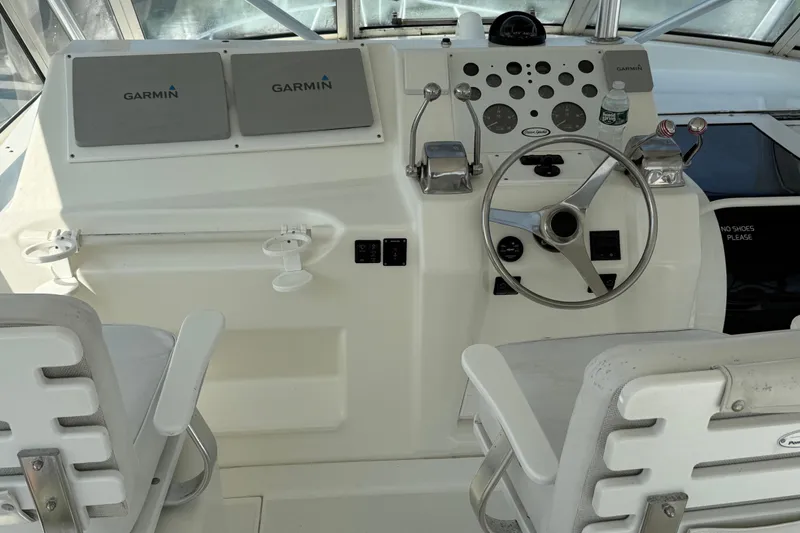 Slide: The Image of Cockpit of 1999 Ocean Yachts 40 Express with Garmin navigation system and steering wheel. - 15