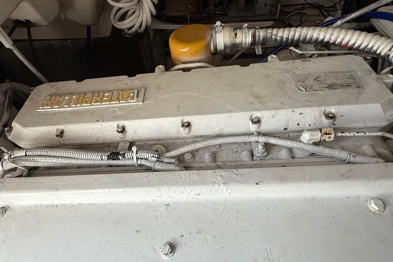 Slide: The Image of Engine compartment of a 1999 Ocean Yachts 40 Express, featuring a Caterpillar engine. - 4