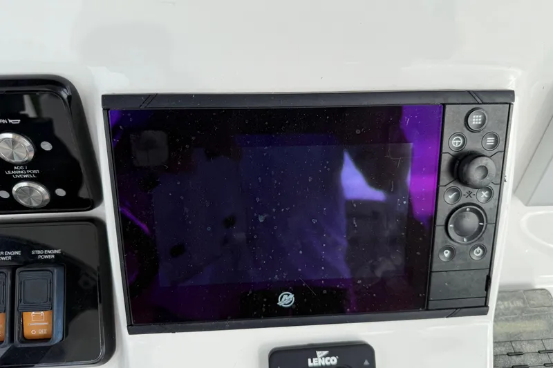 Slide: The Image of Control panel of a 2020 Caymas 341 CC boat with touchscreen and buttons. - 21