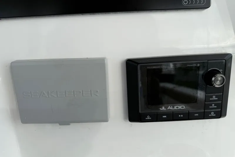 Slide: The Image of Control panel of 2020 Caymas 341 CC with Seakeeper and JL Audio systems. - 22