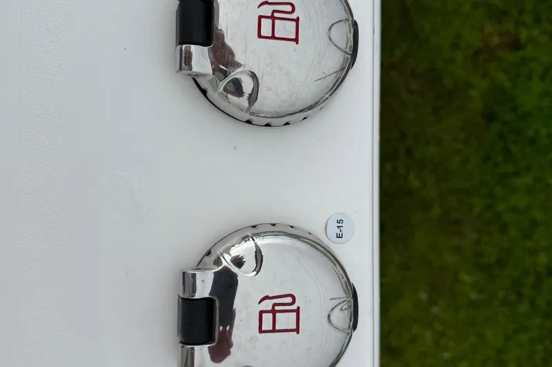 Slide: The Image of Fuel caps on a 2020 Caymas 341 CC boat, labeled with fuel symbols. - 23