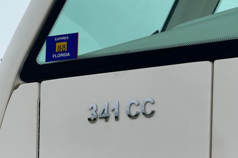 Slide: The Image of Caymas 341 CC boat with Florida registration sticker, expiring May 2025. - 24