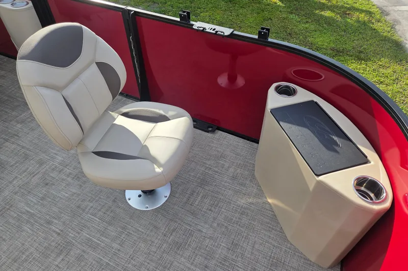 Slide: The Image of 2026 Bentley Pontoons Fish 203 interior with beige seat and red paneling. - 14