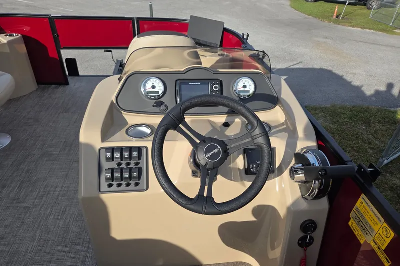 Slide: The Image of 2026 Bentley Pontoons Fish 203 dashboard with steering wheel and control panel. - 17