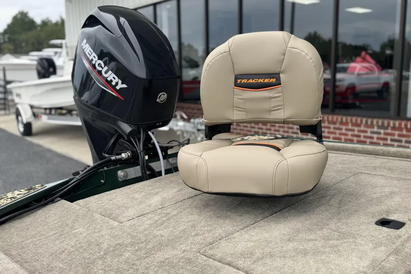 Slide: The Image of 2026 Tracker Bass Tracker Classic Limited boat seat and Mercury engine. - 6