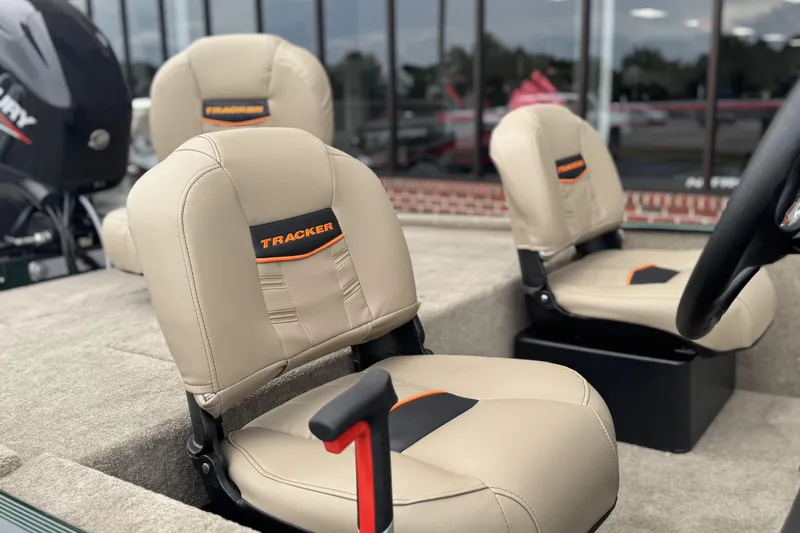 Slide: The Image of 2026 Tracker Bass Tracker Classic Limited boat seats with beige upholstery and logo. - 7
