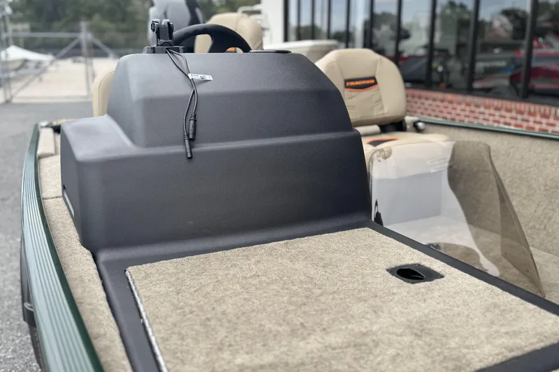Slide: The Image of 2026 Tracker Bass Tracker Classic Limited boat interior with steering console and seating. - 8