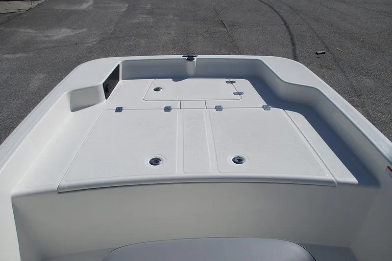 Slide: The Image of 2026 Mako Pro Skiff 15 CC boat deck with storage compartments. - 10