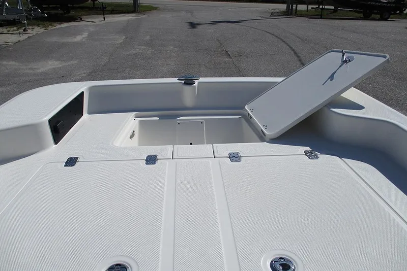Slide: The Image of 2026 Mako Pro Skiff 15 CC boat deck with open storage compartment. - 11