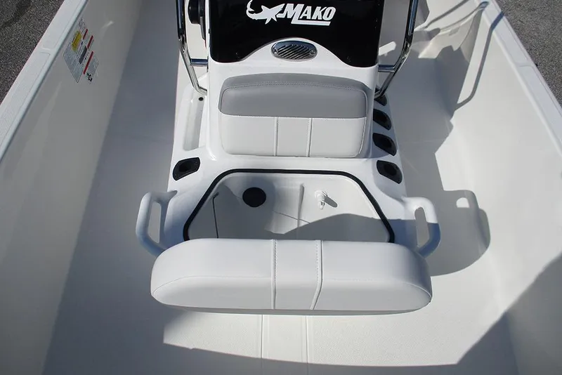 Slide: The Image of 2026 Mako Pro Skiff 15 CC interior with white seating and console. - 16
