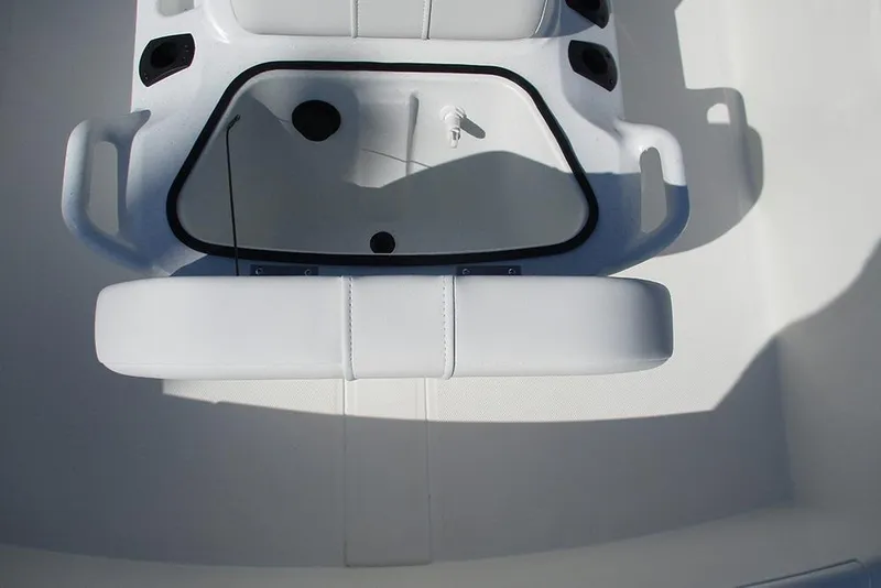 Slide: The Image of 2026 Mako Pro Skiff 15 CC boat interior with white seating and console. - 17