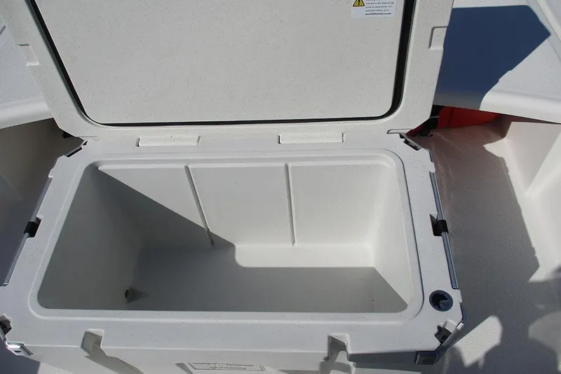 Slide: The Image of Open storage compartment on 2026 Mako Pro Skiff 15 CC boat. - 20