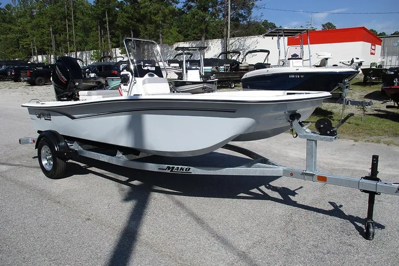Slide: The Image of 2026 Mako Pro Skiff 15 CC boat on trailer in outdoor lot. - 3