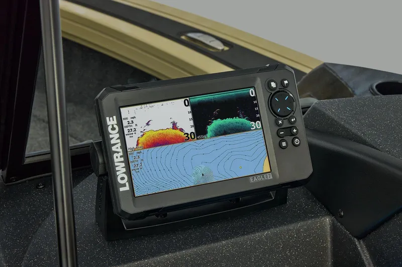 Slide: The Image of 2026 Tracker Targa V-19 Combo boat interior with rod storage and steering console. - 25