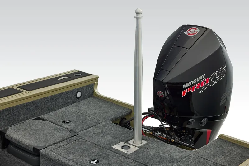 Slide: The Image of 2026 Tracker Targa V-19 Combo boat storage compartment with cup holders and gear. - 46