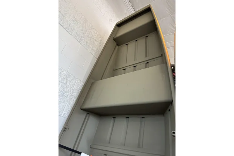 Slide: The Image of 2026 Tracker Grizzly 12 Jon boat interior, showcasing sturdy construction and spacious design. - 2