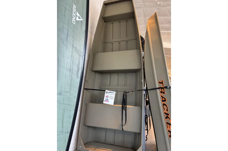 The Image of 2026 Tracker Grizzly 12 Jon boat displayed vertically in showroom. - 0