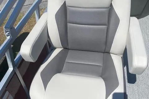 Slide: The Image of 2026 Sun Tracker Bass Buggy 18 DLX boat seat, featuring gray and white upholstery. - 5