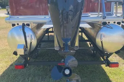 Slide: The Image of 2026 Sun Tracker Bass Buggy 18 DLX pontoon boat rear view with dual pontoons. - 6