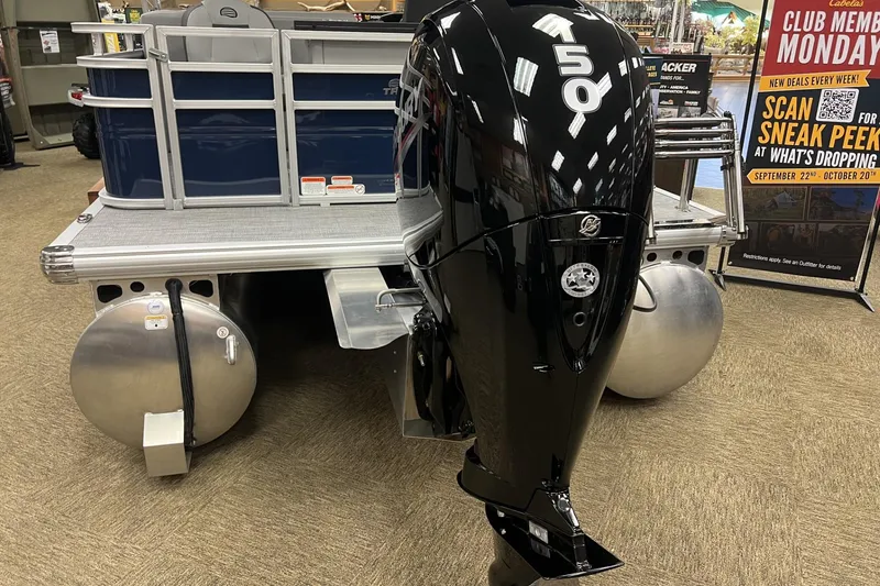 Slide: The Image of 2026 Sun Tracker SportFish 22 DLX pontoon boat with powerful 150 HP outboard motor. - 2