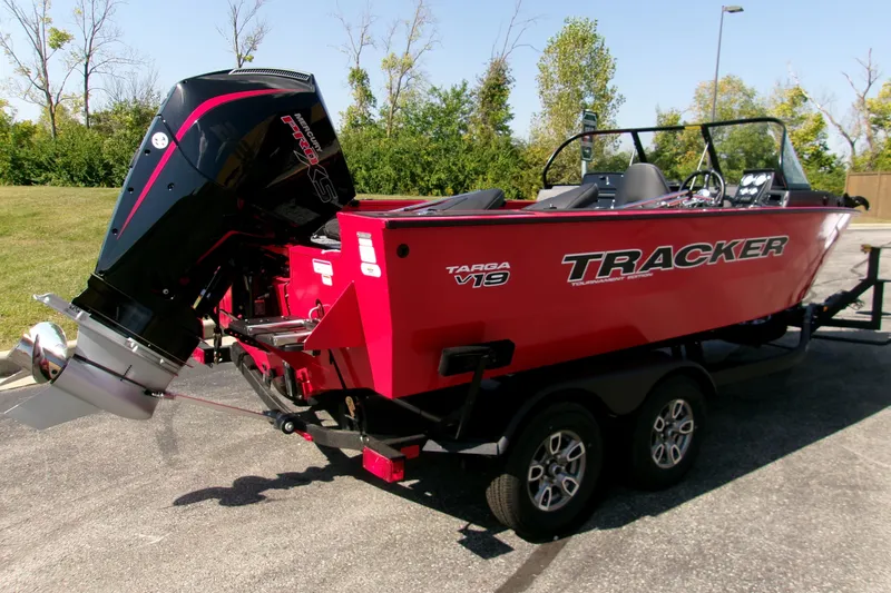 Slide: The Image of 2026 Tracker Targa V-19 Combo boat on trailer, red exterior, parked outdoors. - 3