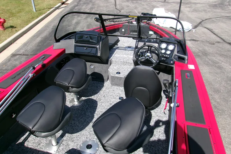 Slide: The Image of 2026 Tracker Targa V-19 Combo boat interior with black seats and modern dashboard. - 6