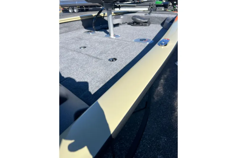 Slide: The Image of 2026 Tracker Pro Team 175 Crappie Edition boat deck with seating and storage. - 4