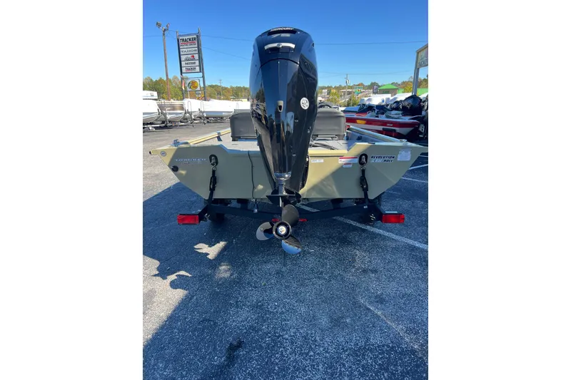 Slide: The Image of 2026 Tracker Pro Team 175 Crappie Edition boat, rear view with motor, in parking lot. - 5
