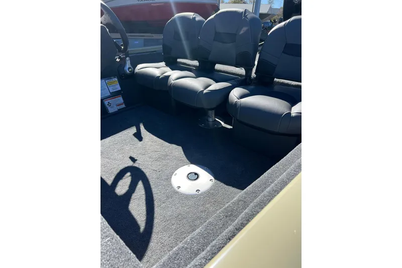 Slide: The Image of 2026 Tracker Pro Team 175 Crappie Edition boat interior with seating and steering wheel. - 7
