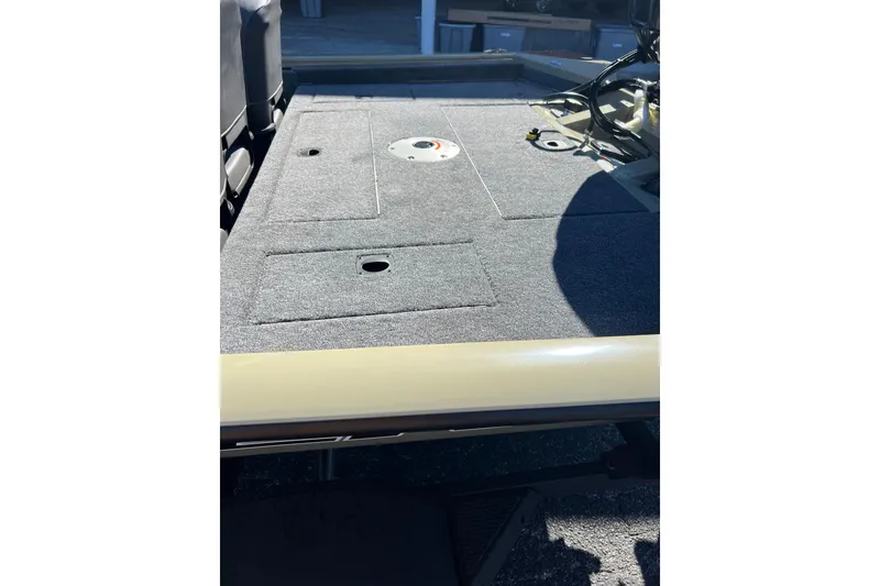 Slide: The Image of 2026 Tracker Pro Team 175 Crappie Edition boat deck with storage compartments. - 9