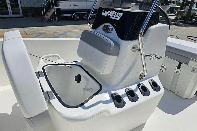 Slide: The Image of 2026 Mako Pro Skiff 15 CC boat interior with console and rod holders. - 13