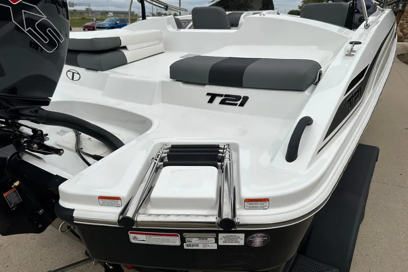 Slide: The Image of 2026 Tahoe T21 boat with sleek design, rear seating, and outboard motor. - 3