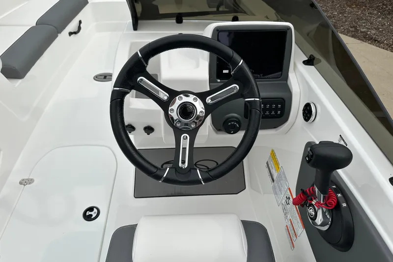 Slide: The Image of 2026 Tahoe T21 boat cockpit with steering wheel and control panel. - 7