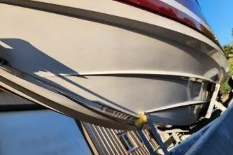 Slide: The Image of 2008 Larson LXi 288 boat on trailer, side view. - 30