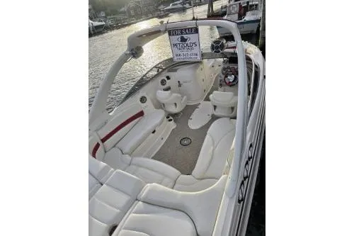 Slide: The Image of 2008 Larson LXi 288 boat for sale, white interior, docked by the water. - 36