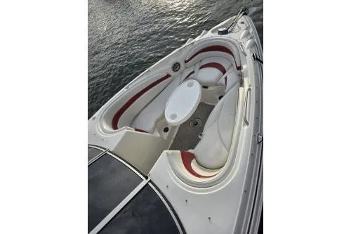 Slide: The Image of 2008 Larson LXi 288 boat bow with seating and table on water. - 37