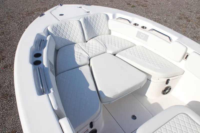 Slide: The Image of 2026 Sea Fox 248 Commander boat with luxurious white seating and cup holders. - 14