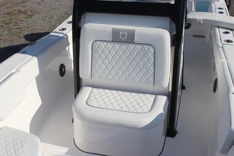 Slide: The Image of 2026 Sea Fox 248 Commander boat interior with white quilted seating. - 16