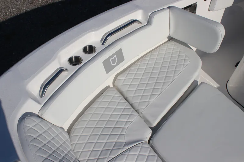 Slide: The Image of 2026 Sea Fox 248 Commander boat seating with quilted cushions and cup holders. - 19