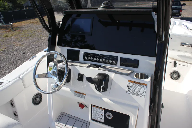 Slide: The Image of 2026 Sea Fox 248 Commander boat dashboard with steering wheel and control panel. - 20