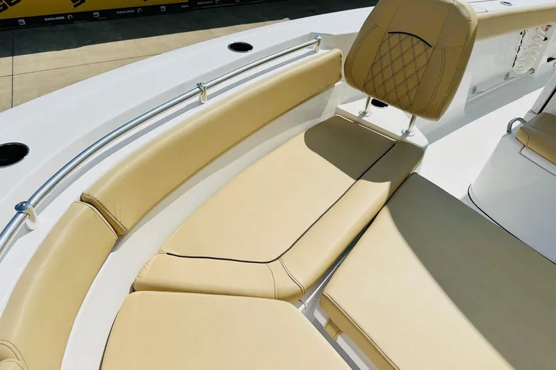 Slide: The Image of 2025 Sportsman Heritage 261 Center Console boat with tan seating and stainless steel railings. - 10