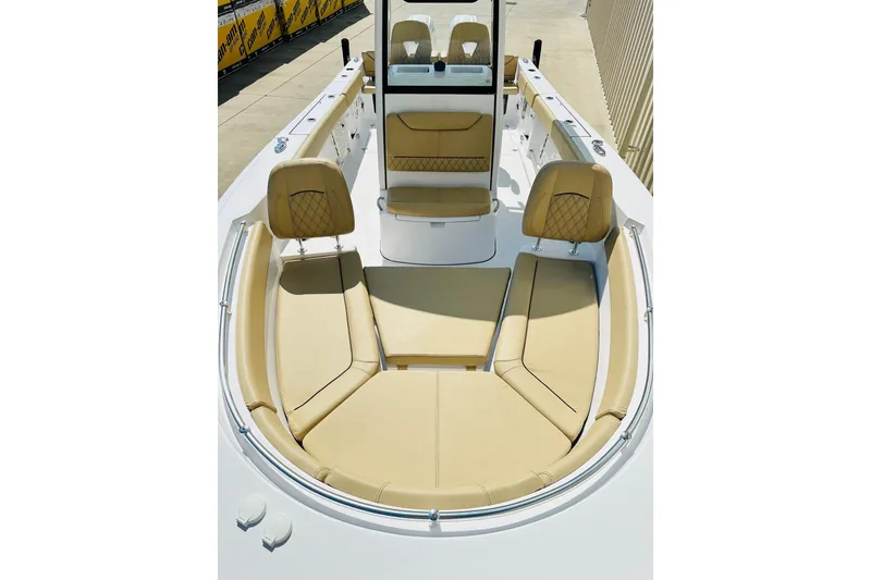 Slide: The Image of 2025 Sportsman Heritage 261 Center Console boat with tan seating and sleek design. - 11
