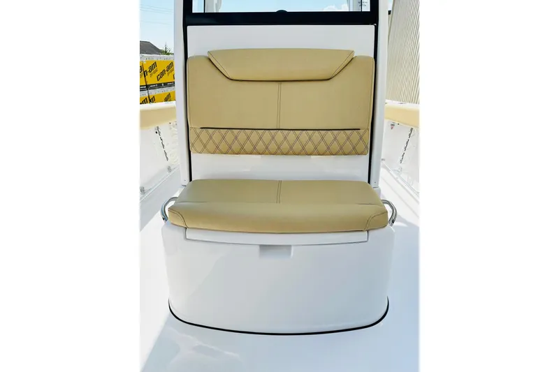 Slide: The Image of 2025 Sportsman Heritage 261 Center Console seat with beige upholstery and diamond stitching. - 12