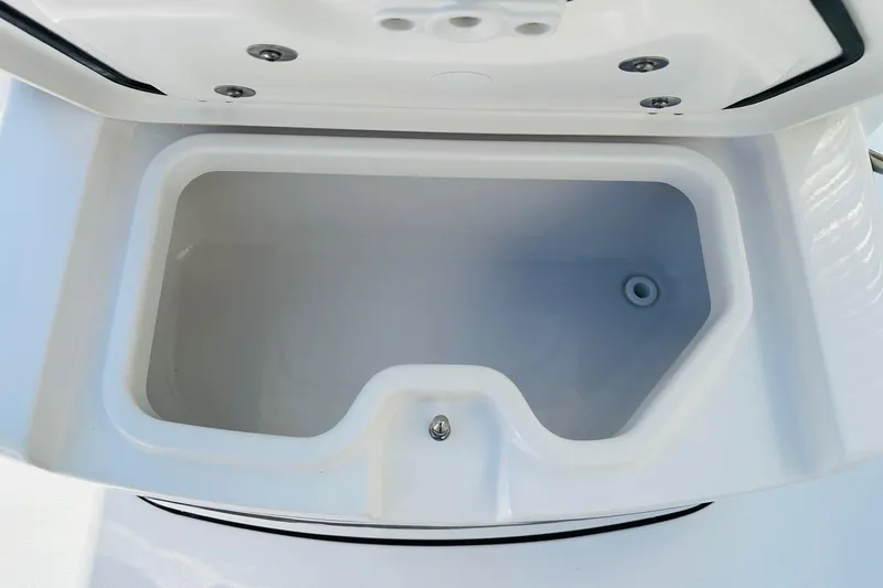 Slide: The Image of Open storage compartment on 2025 Sportsman Heritage 261 Center Console boat. - 13