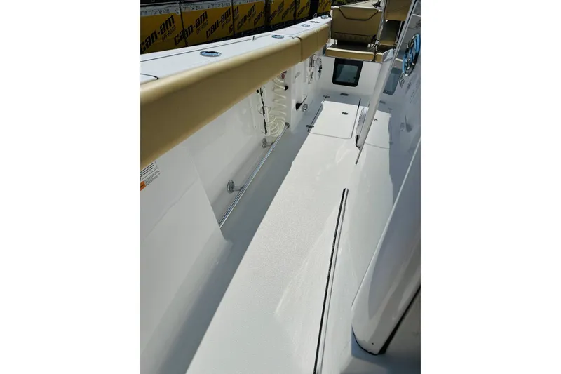 Slide: The Image of 2025 Sportsman Heritage 261 Center Console boat interior with seating and storage compartments. - 14