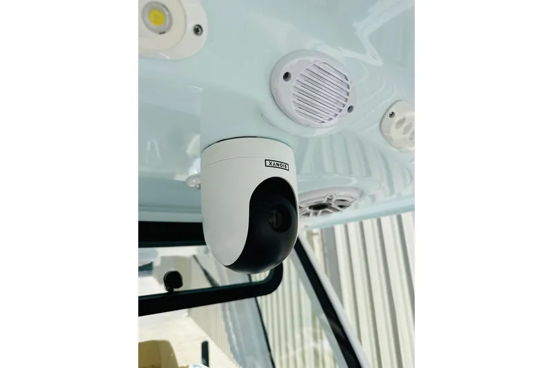 Slide: The Image of 2025 Sportsman Heritage 261 Center Console with mounted security camera and speaker system. - 18