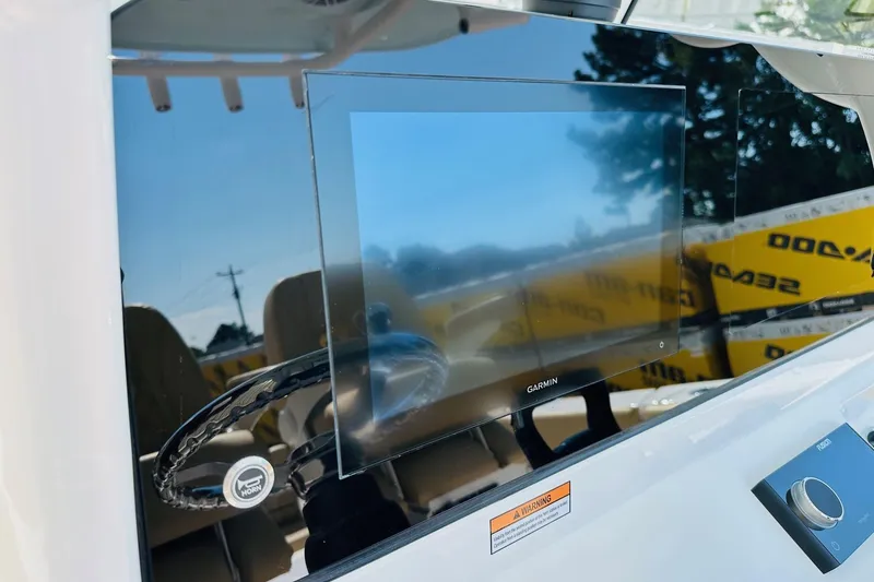 Slide: The Image of 2025 Sportsman Heritage 261 Center Console with Garmin display and steering wheel. - 3